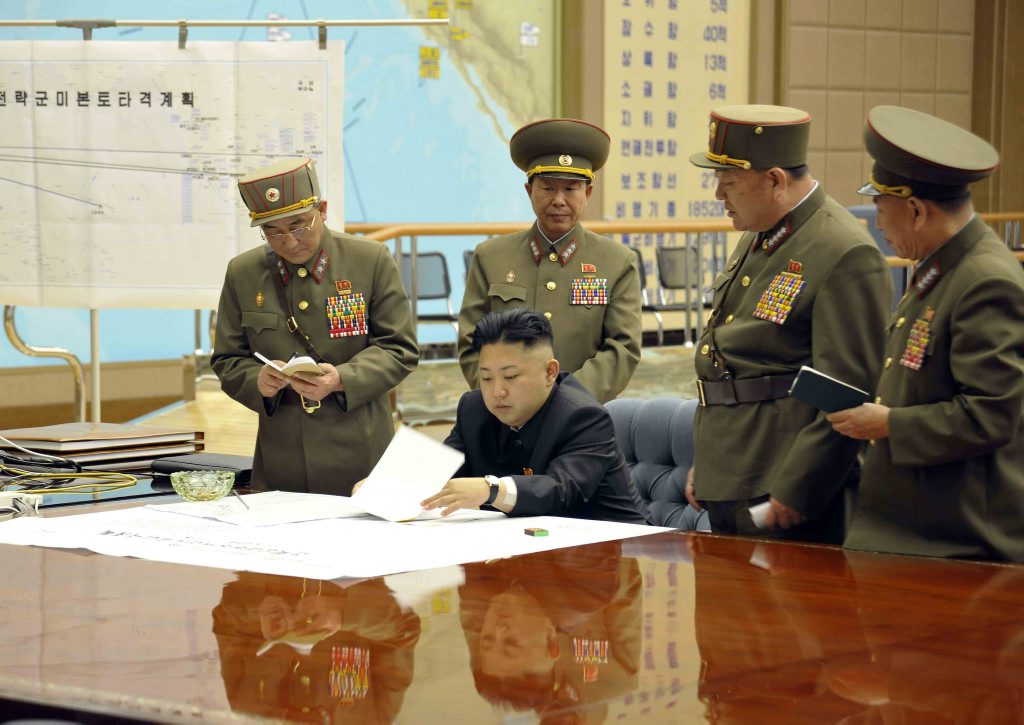 A picture released by the North Korean Central News Agency (KCNA) on 29 March 2013 shows North Korean leader Kim Jong-un (sitting) convening an urgent operation meeting at 0:30 am on 29 March 2013 at an undisclosed location, in which he ordered strategic rocket forces to be on standby to strike US and South Korean targets at any time. A picture released by the North Korean Central News Agency (KCNA) on 29 March 2013 shows North Korean leader Kim Jong-un (sitting) convening an urgent operation meeting at 0:30 am on 29 March 2013 at an undisclosed location, in which he ordered strategic rocket forces to be on standby to strike US and South Korean targets at any time.